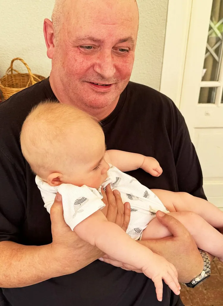 Me with my four-month-old grandnephew, Theodore. A sign of new life, and new beginnings.